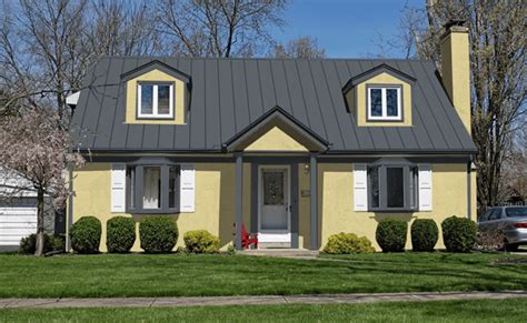 yellow house with gray metal roof|brown roof house color scheme.